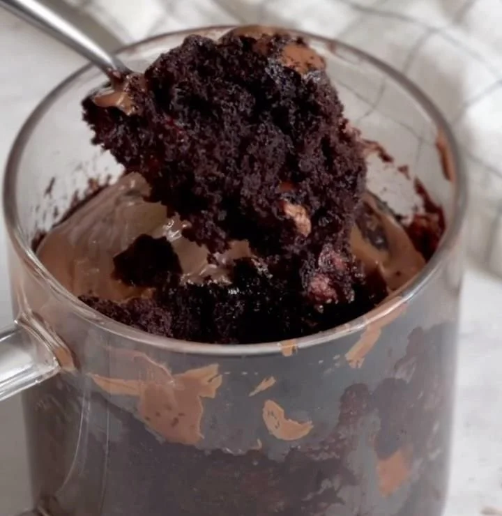 5 Minute Chocolate Mug Cake topped with chocolate chips in a mug