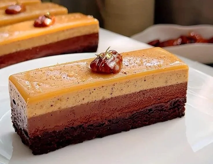 Decadent chocolate brownie with tonka bean mousse and pecan praline topping