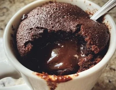 Decadent chocolate lava mug cake ready in 5 minutes, perfect for quick indulgence.