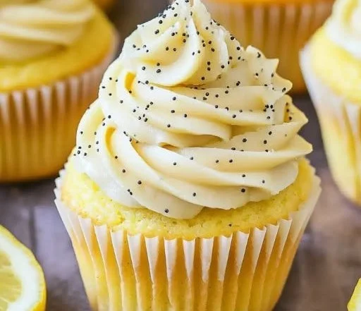Delicious lemon poppy seed cupcakes topped with lemon frosting.