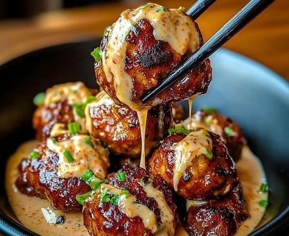 Korean BBQ Meatballs served with spicy mayo dip on a plate