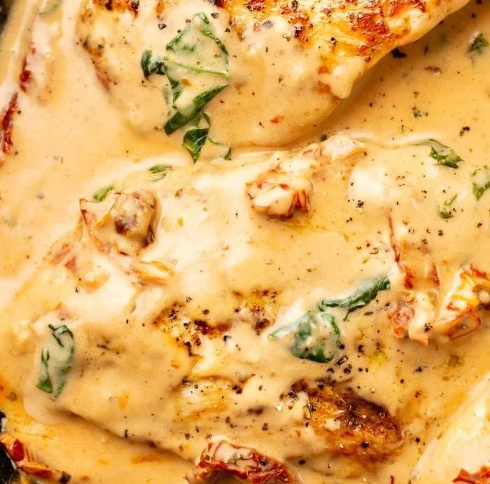 Delicious Marry Me Chicken served with herbs and creamy sauce.