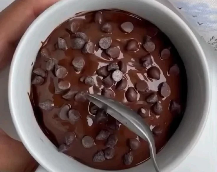 Delicious homemade mug chocolate cake topped with choco chips