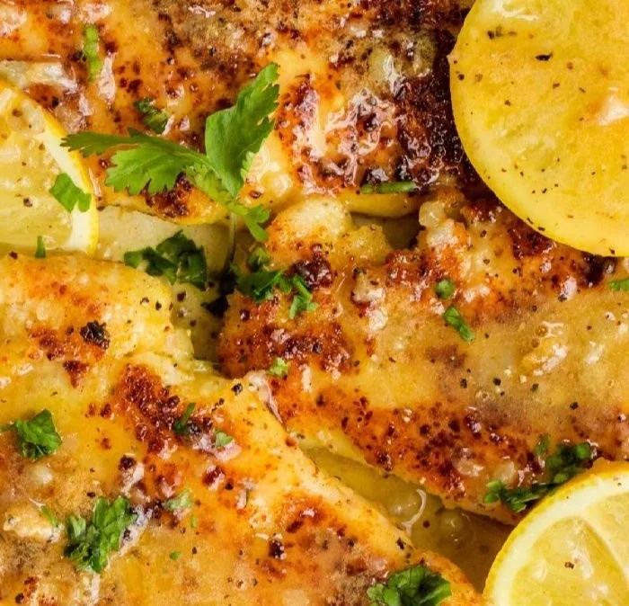 Quick and Easy Lemon Chicken dish garnished with lemon slices and herbs