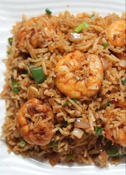 Delicious shrimp fried rice with vibrant vegetables and shrimp on a plate