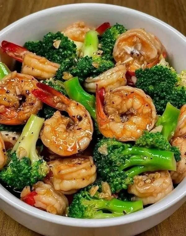 Delicious stir-fried shrimp and broccoli served on a plate