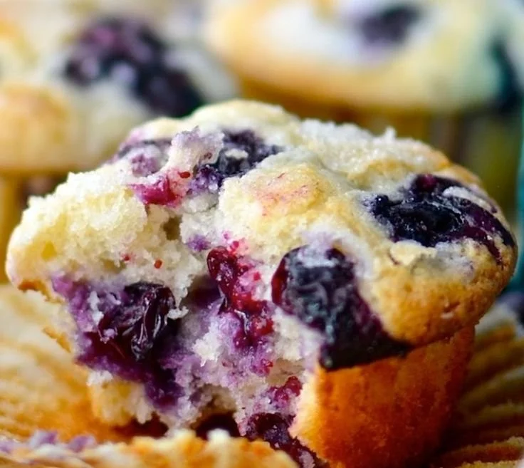 Delicious blueberry muffins fresh out of the oven with plump blueberries