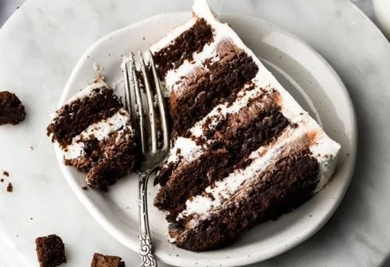 Delicious and rich ultimate brownie cake topped with chocolate drizzle