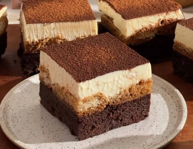 Delicious tiramisu brownies topped with cocoa and espresso.