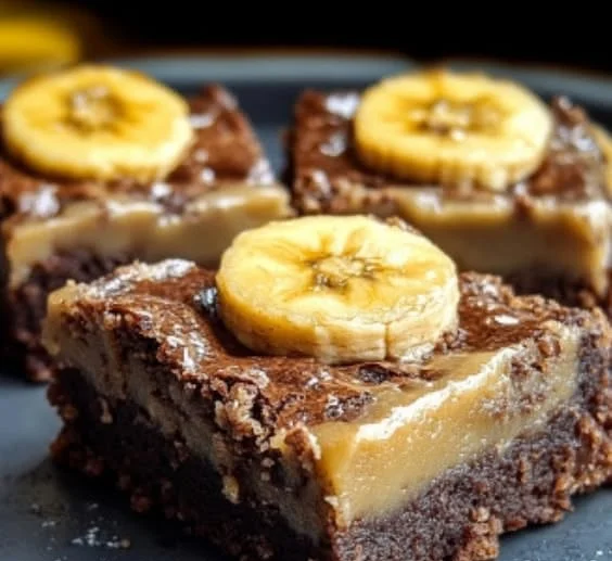 Delicious banana bread brownies served on a wooden plate.