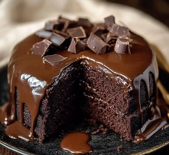 Delicious Brick Street chocolate cake served with a slice cut out