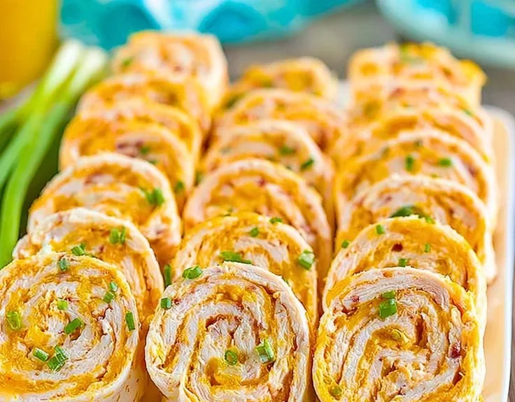 Easy Buffalo Chicken Pinwheels ready to serve, flavorful party snack.