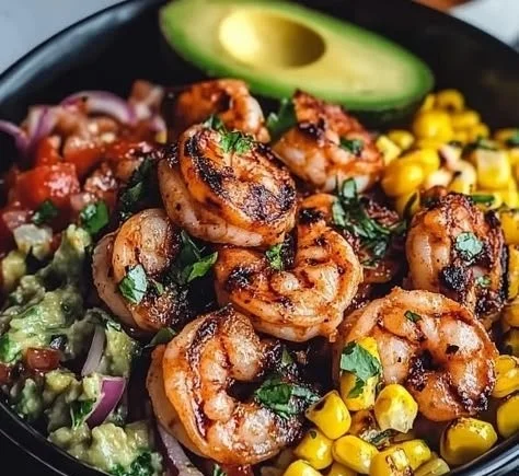 Colorful grilled shrimp bowl with vegetables and grains