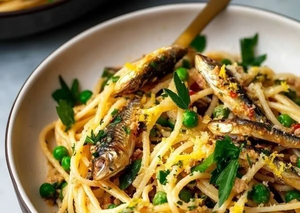 Healthy sardine pasta dish served with herbs and spices