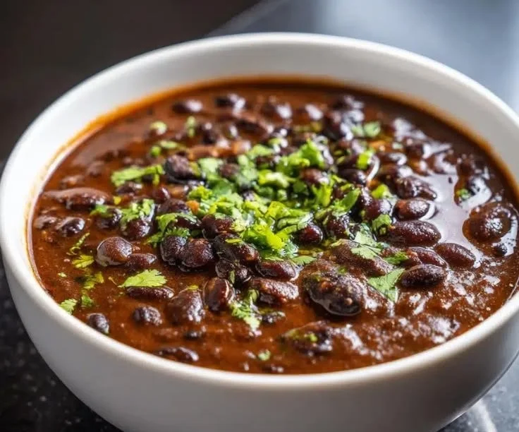 Bowl of Minute Black Bean Soup with Garlic and Onion