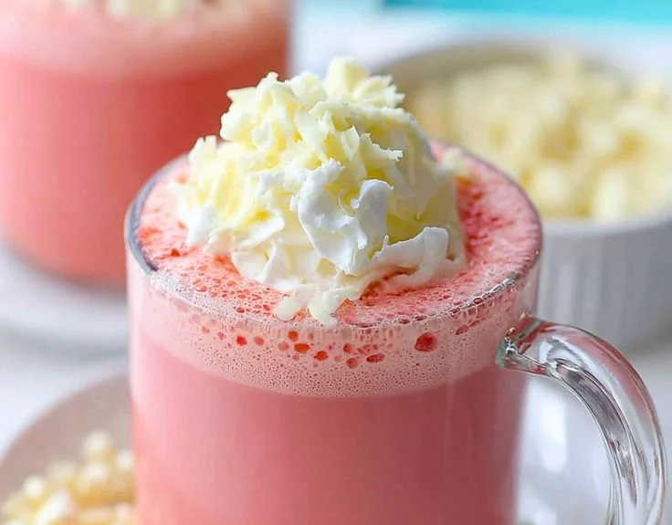 Delicious strawberry hot chocolate in a cozy mug with fresh strawberries
