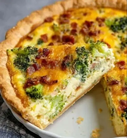 Homemade broccoli cheddar quiche with fresh ingredients and a golden crust