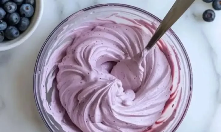 Delicious blueberry cream cheese frosting on a cake