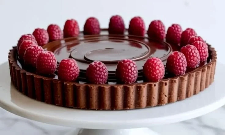 Decadent Chocolate Raspberry Tart with fresh raspberries and chocolate ganache