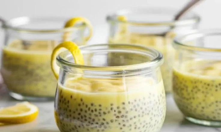 Delicious lemon chia pudding served in a glass with lemon slices on top.