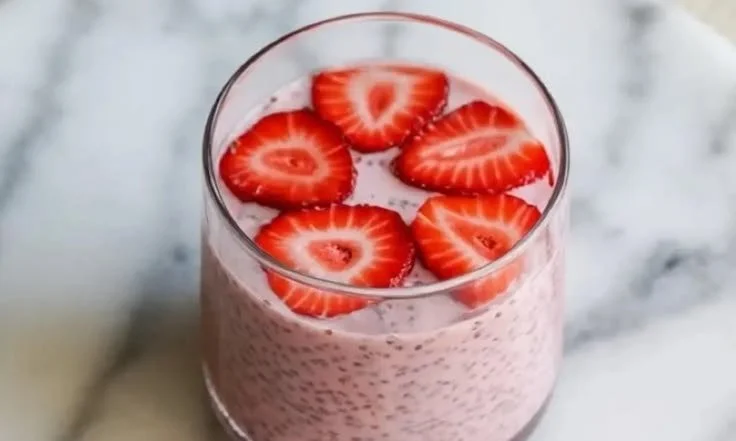 Delicious strawberry chia seed pudding topped with fresh strawberries.
